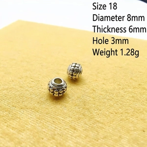 Detail of 8mm vintage silver spacer beads with dot relief for DIY jewelry making