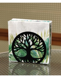 Detail of black metal tree of life napkin holder with tropical leaf tissues on glass