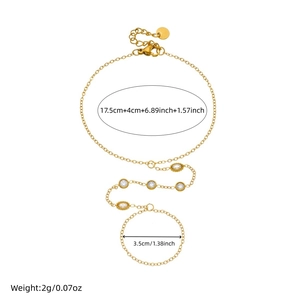 Gold stainless steel finger bracelet with geometric cubic zirconia accents and ring detail