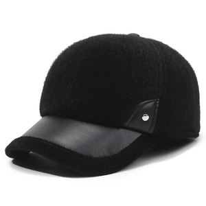 Thick warm winter baseball cap for men in black faux fur and matte leather details