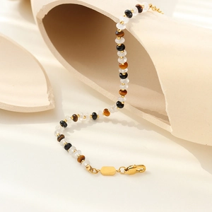 Bracelet Bali style bohème avec pierres œil de tigre et fermoir mousqueton doré