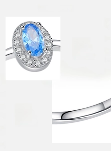 Macro shot of 925 sterling silver ring with 5A blue oval zircon and S925 hallmark