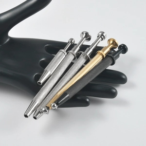 Detail of multi-color four-claw pick-up tools with non-slip knurled handles