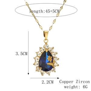 Detailed view of blue teardrop pendant with dimensions 3.5cm by 2.2cm on a gold chain