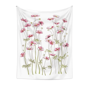 Detailed view of hand-painted pink and white cosmos flowers on a fabric bohemian tapestry