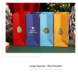 Set of four colorful Christmas gift bags featuring festive trees and wreaths on thick paper