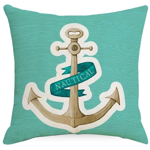 Detail of teal linen pillow cover featuring a beige nautical anchor print and textile texture