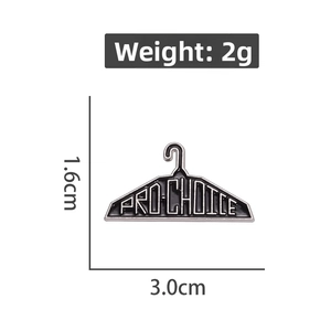 Detail view showing black clothes hanger enamel pin with Pro-Choice text and 3cm dimensions