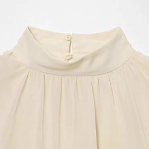 Elegant cream high-neck blouse with delicate pleated front and back button closure