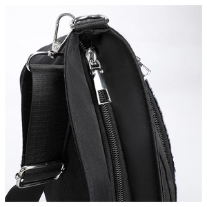 Detail of silver metal hardware and dual zipper on black gothic skull shoulder bag