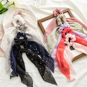 Chiffon scrunchies with long ribbons and golden star patterns in various colors