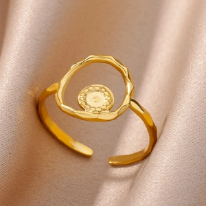 Macro detail of 18k gold plated stainless steel ring with hammered texture and hollow design