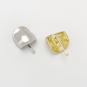 Detailed view of silver and gold alloy ponytail hair hooks with smooth polished metallic finish