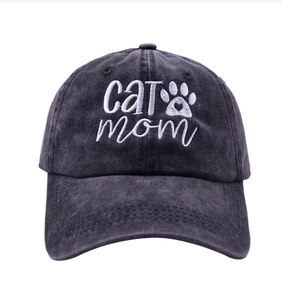 Detailed embroidery of white cat mom text and a small paw on black washed denim cap