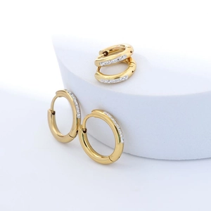 Women's gold titanium steel hoop earrings with crystal pavé and polished finish