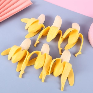 Set of six realistic peeled banana squeeze toys for stress relief on colorful background