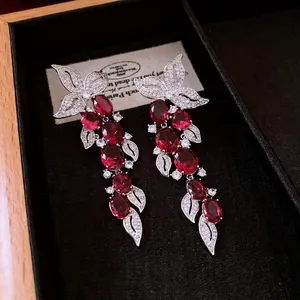 Vintage leaf zircon tassel earrings with red gemstones in a black luxury gift box