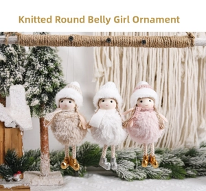 Three knitted Christmas doll ornaments with pom-poms hanging on a rustic wooden bar