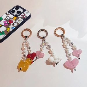 Colorful beaded keychains with duck and heart charms, white pearls and crystal beads