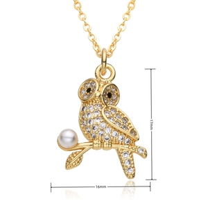 Macro view of crystal owl pendant dimensions 17mm by 16mm with pearl accent