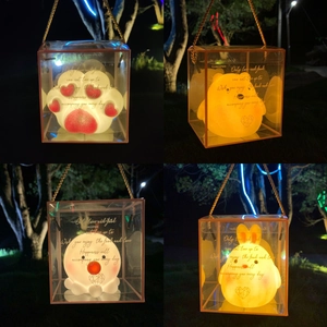 Creative battery-operated night lights in portable gift boxes glowing in the dark