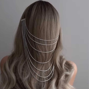 Elegant multi-layer silver rhinestone tassel hair chain on model's long wavy hair