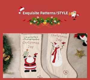 Detailed embroidery of Santa and Snowman on linen Christmas stockings with red hanging loop