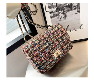Detail shot of multi-color tweed texture and gold chain strap on flap shoulder bag