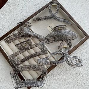 Elegant transparent lace hair claw clips set in various shapes with gold spring details