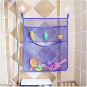 Close-up of blue multi-layer mesh bath toy organizer with white suction cups on wall