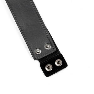Close-up of black elastic waist belt featuring silver metal snap buttons and fine stitching