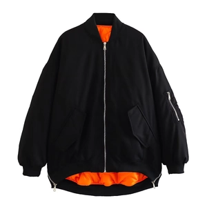 Detailed view of black bomber jacket with orange lining and sleeve flight pocket