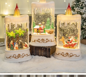 Close-up of LED Christmas candle snow globes with nativity, Santa, and reindeer scenes