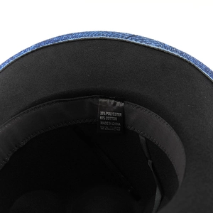 Internal detail of blue western cowboy hat with cotton blend lining and care label