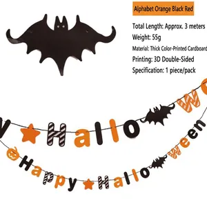 Detail of Happy Halloween paper banner featuring orange pumpkin and bat decorations