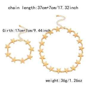 Flat lay of gold starfish necklace and bracelet set with size and weight specifications