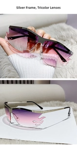 Detail of silver frame sunglasses with purple gradient flame-shaped rimless lenses