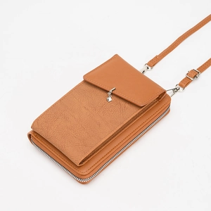 Brown textured PU leather crossbody phone bag with adjustable strap and metal pendant charm