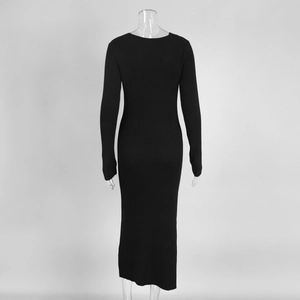 Detail of black ribbed knit dress back view on a mannequin with slim fit silhouette
