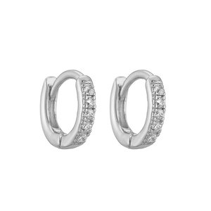 Detail of silver huggie hoop earrings with micro-pave cubic zirconia inlay stones