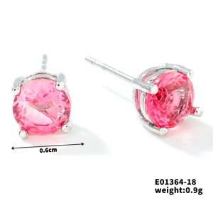 Detail showing 6mm pink round crystal stud earrings with silver four-prong setting