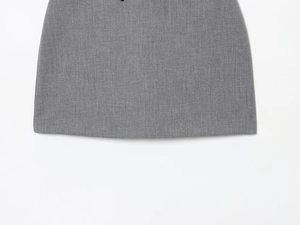 Detailed close-up of grey satin texture and high-quality stitching on mini dress