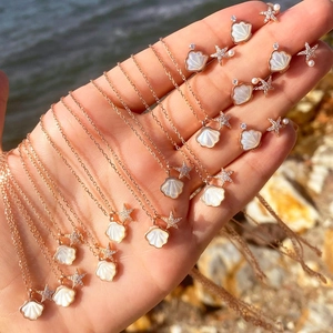 Rose gold starfish shell necklace and earrings set with diamonds for women