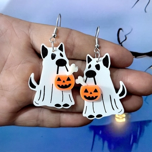 Halloween ghost dog acrylic earrings with pumpkin lantern bucket on a festive background