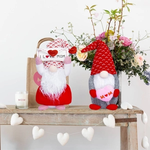 Gnome dolls with I Love Mom envelopes on a rustic wooden table for Mother's Day decor