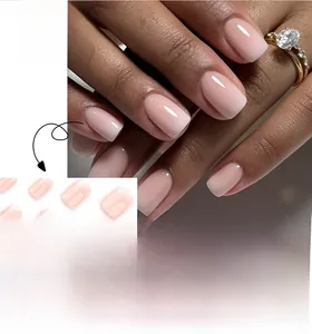 Detailed close-up of short square pink ombre press-on nails with natural gradient finish