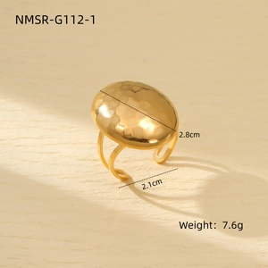 Macro view of gold stainless steel ring with hammered oval surface and size dimensions