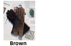 Close-up of brown plaid knitted gloves with touchscreen tips on a magazine background
