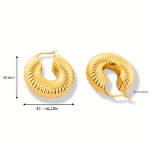 Detail view of 30mm gold textured hoop earrings with dimensions and ribbed surface