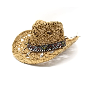 Vintage hollow straw cowboy hat with ethnic geometric band and silver leaf pendants